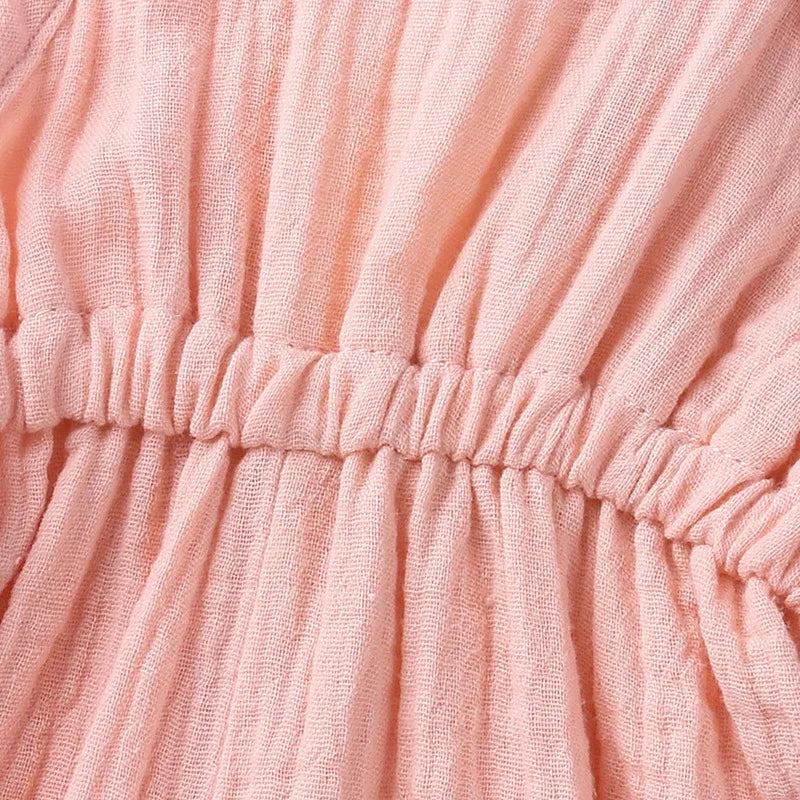 Close-up of pink textured fabric with folds
