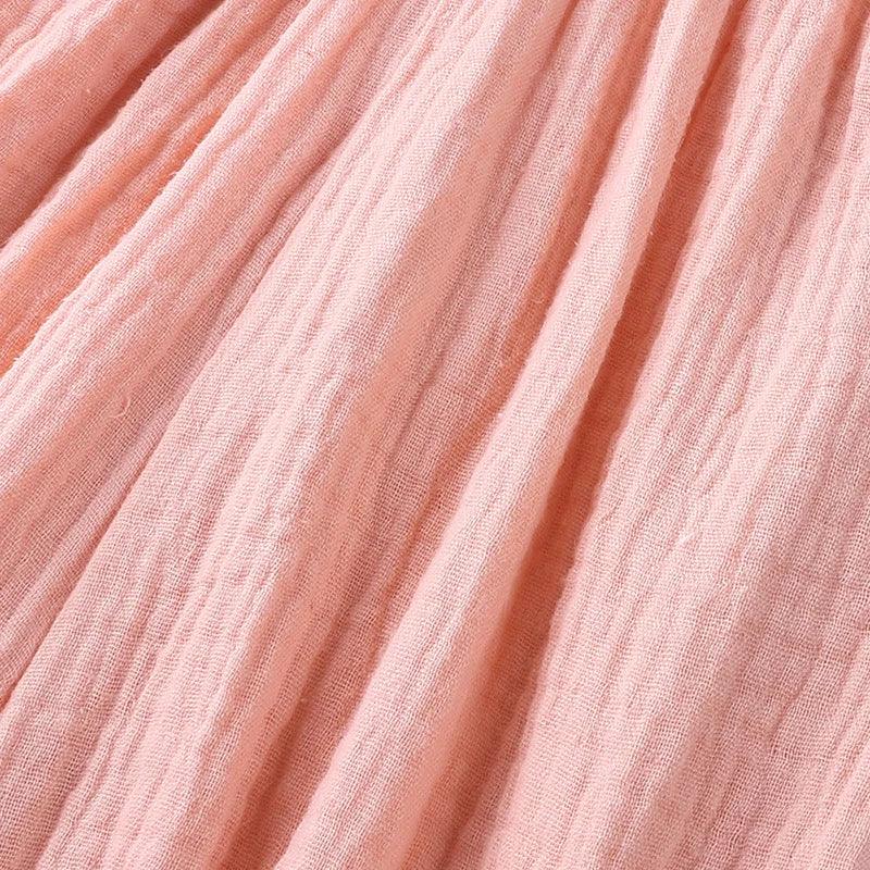 Close-up of pink fabric with folds