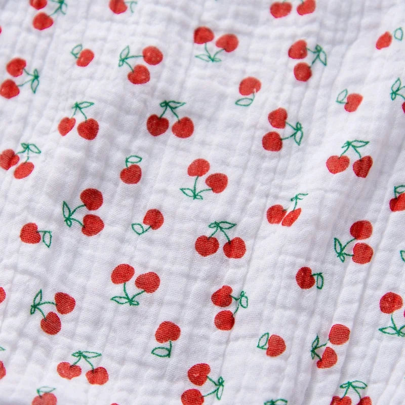 White fabric with red cherry pattern