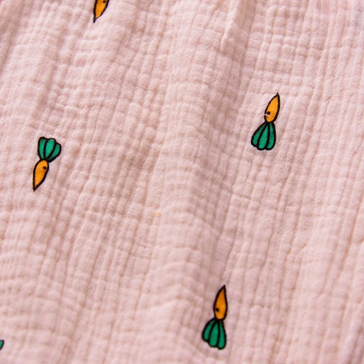 Small cartoon-like carrot illustrations on a textured beige background