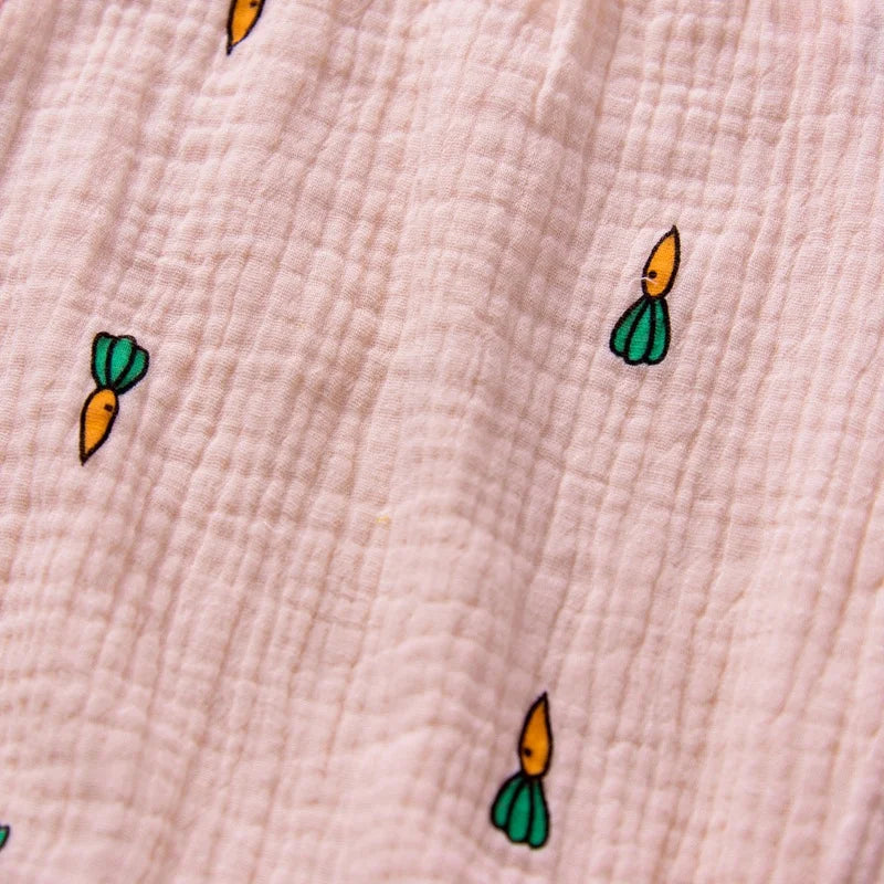 Small cartoon-like carrot illustrations on a textured beige background
