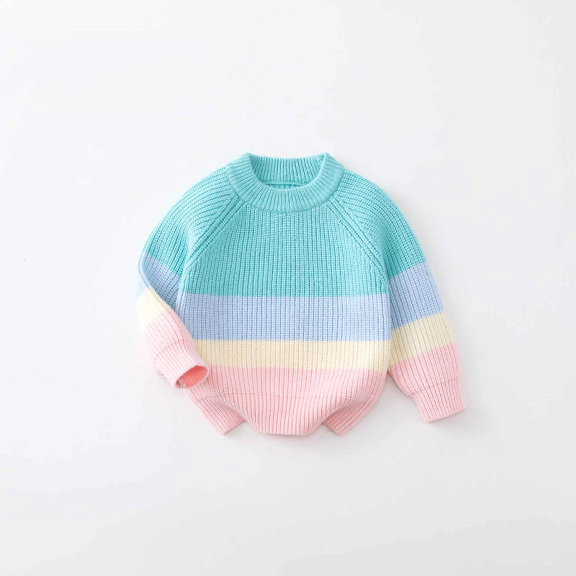 Pastel striped sweater on a light gray background