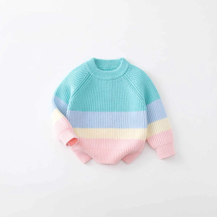 Pastel striped sweater on a light gray background