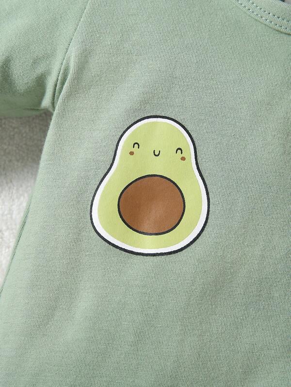Green shirt with a cute avocado design on a soft surface