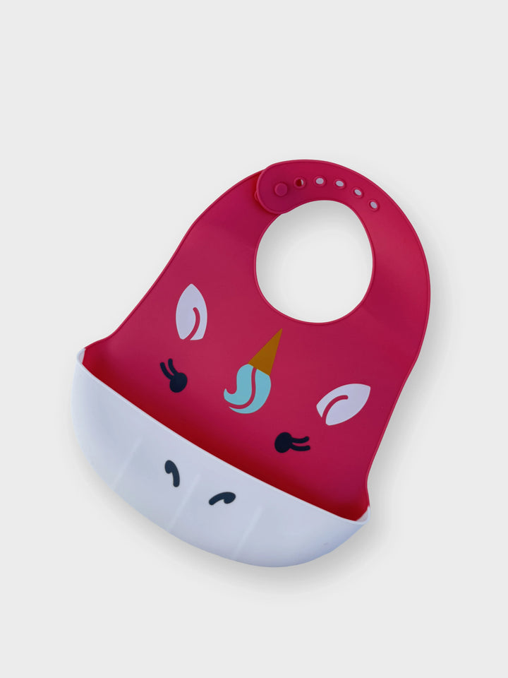 Red and white bib with cartoon design on a light gray background