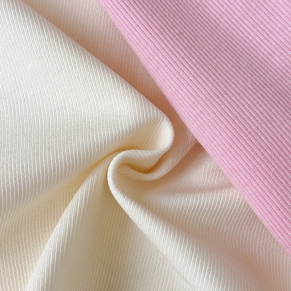 Close-up of beige and pink ribbed fabric