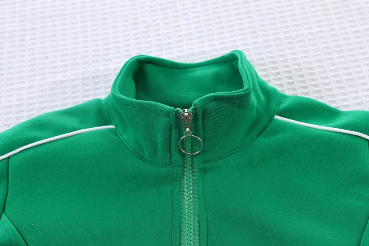 Green jacket with a zipper on a white textured background