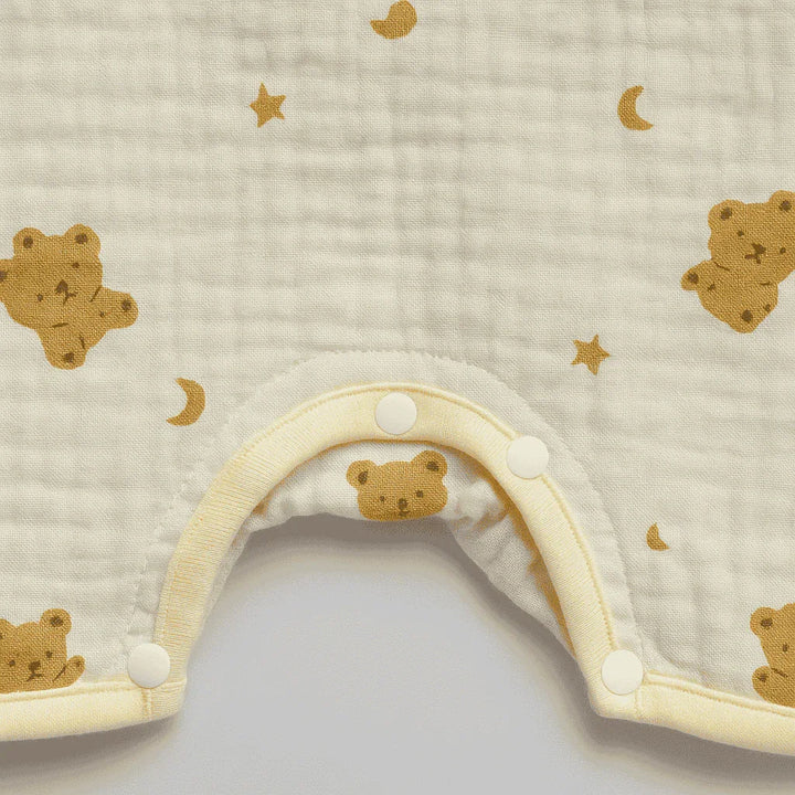 Baby hat with bear pattern on a textured beige background