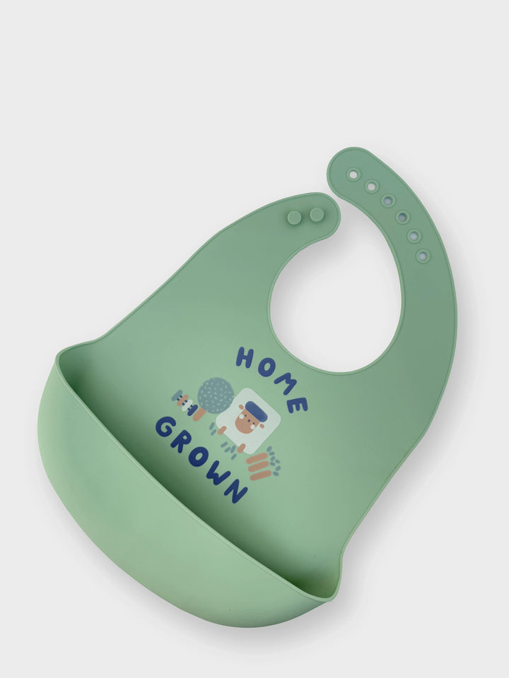 Green bib with 'Home Grown' text and illustrations on a white background