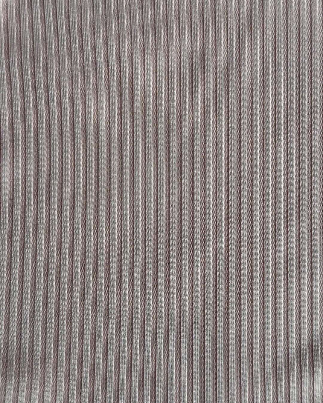 Close-up of gray fabric with subtle striped pattern