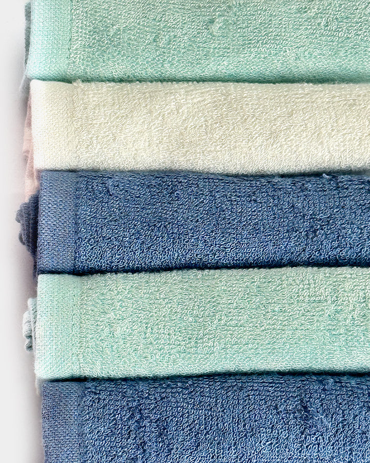 Stack of green and blue towels.