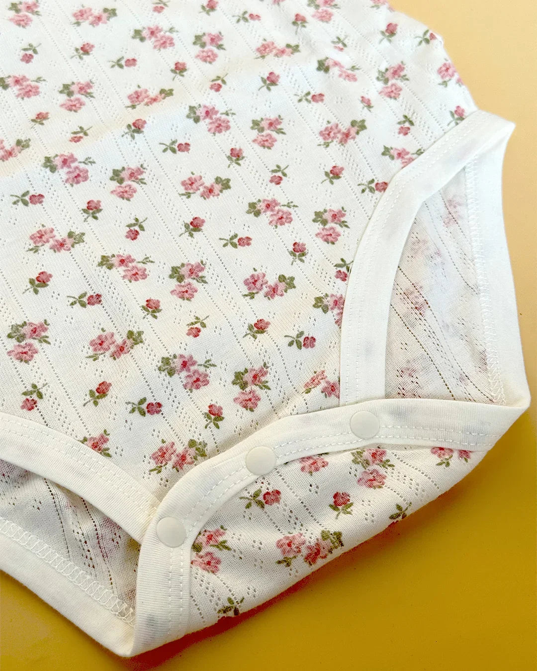 Floral-patterned underwear on a yellow background