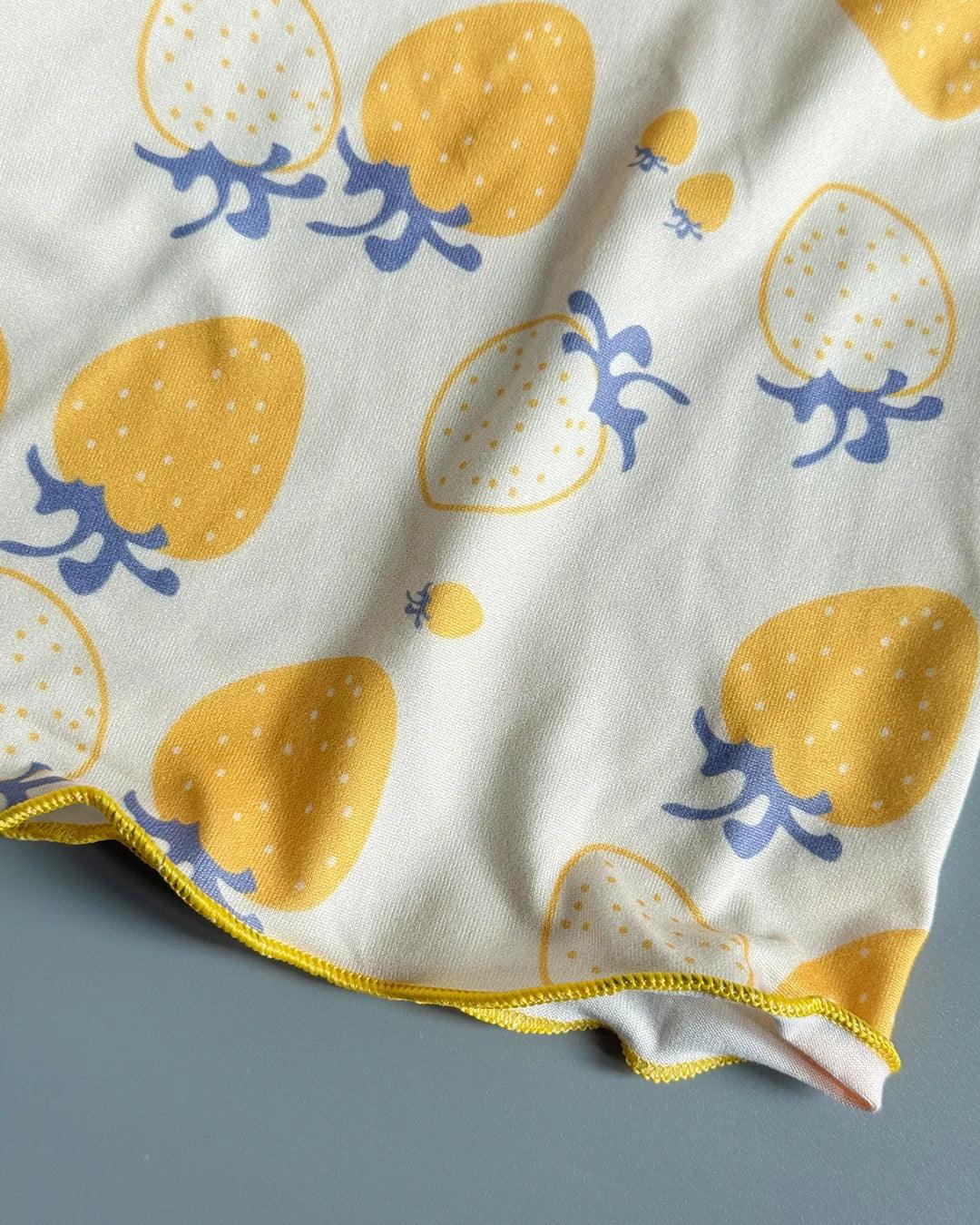 Fabric with yellow strawberry pattern on a gray background