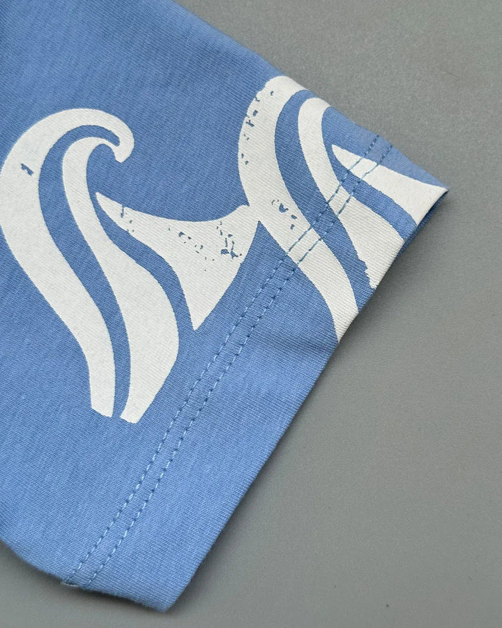 Blue fabric with white abstract pattern on a gray background