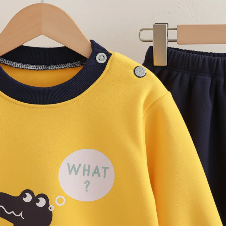Yellow shirt with a cartoon design and text on a hanger