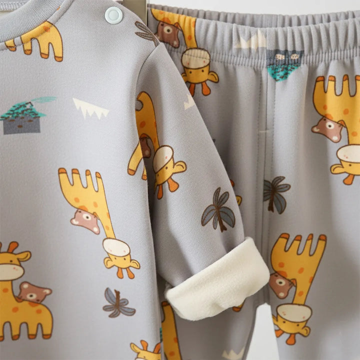 Children's outfit with cartoon animal patterns on a gray background