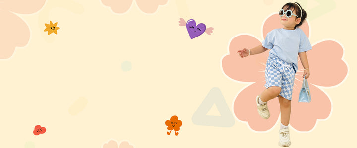 Child in a light blue shirt and checkered shorts standing on a pink floral background with colorful shapes.