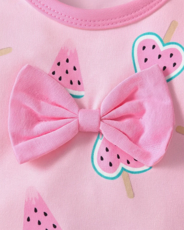 Pink outfit with a large bow and watermelon slice designs on a pink background