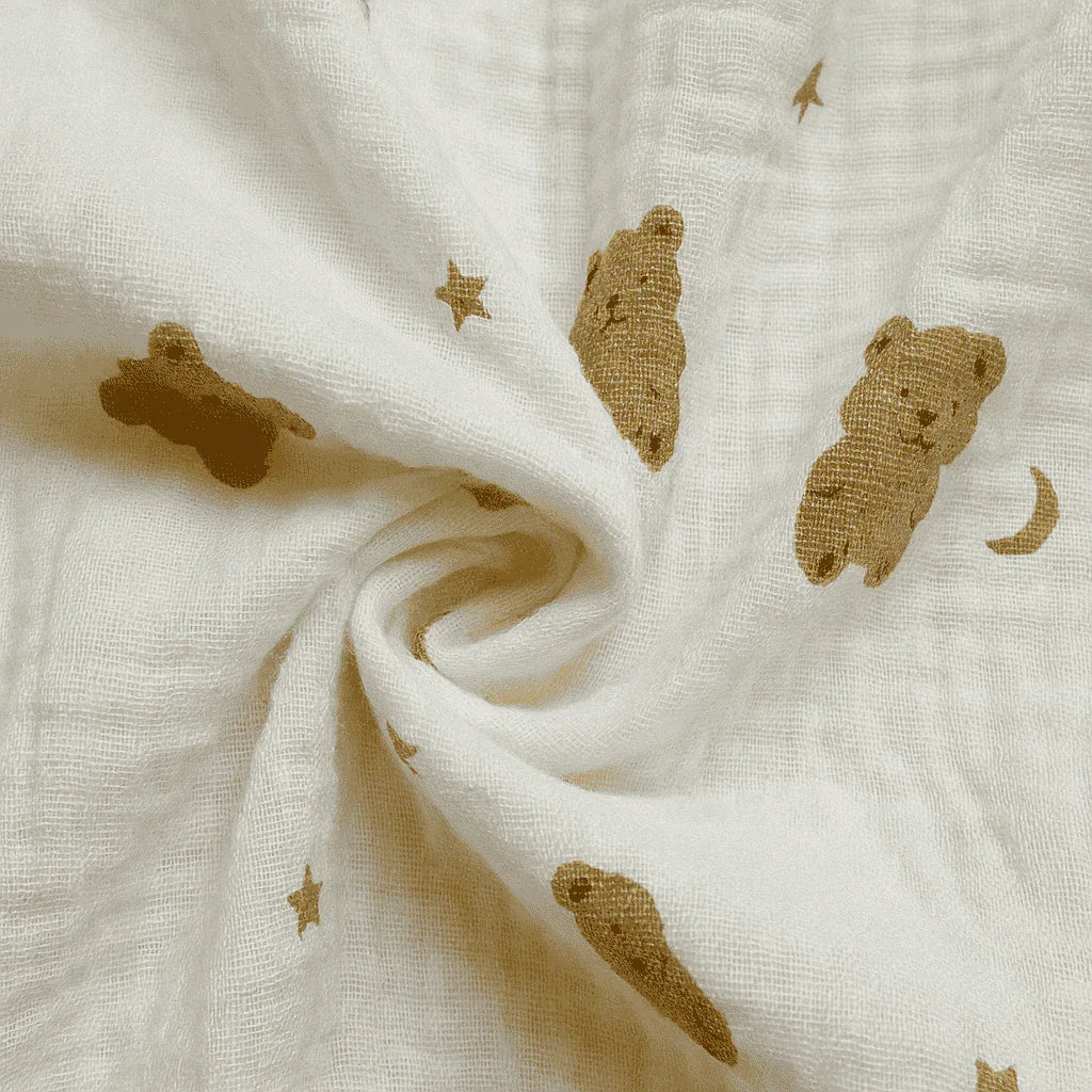White fabric with brown teddy bear and star patterns