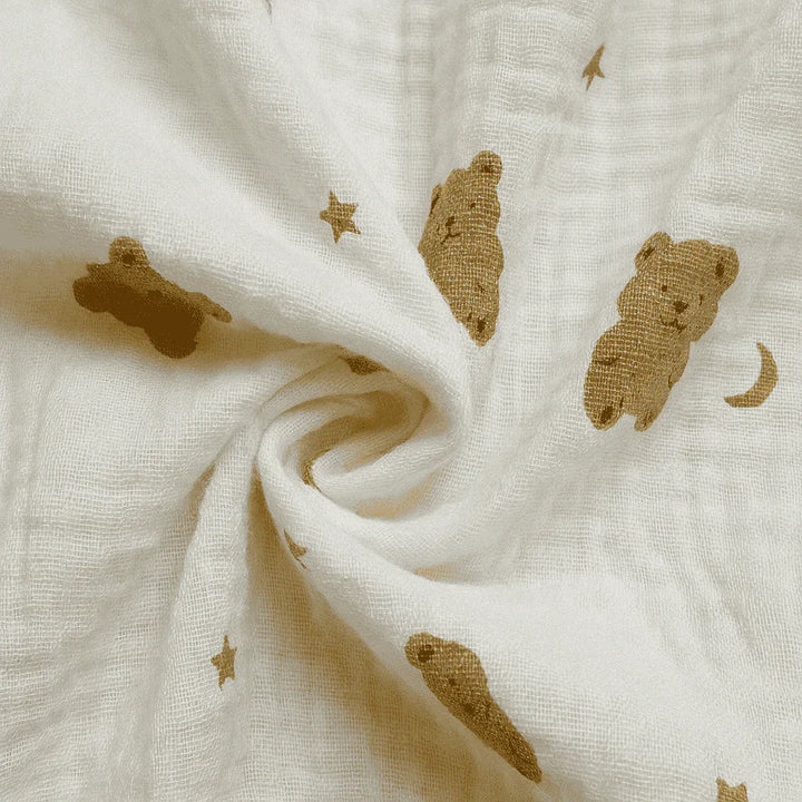 White fabric with brown teddy bear and star patterns