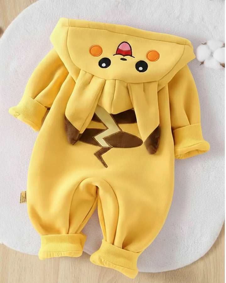 Yellow baby romper with cartoon face design on a light background