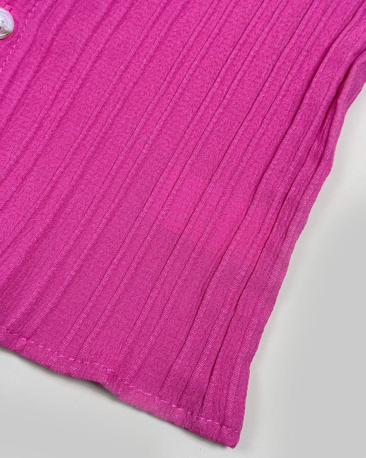 Close-up of a pink textured fabric on a light gray background