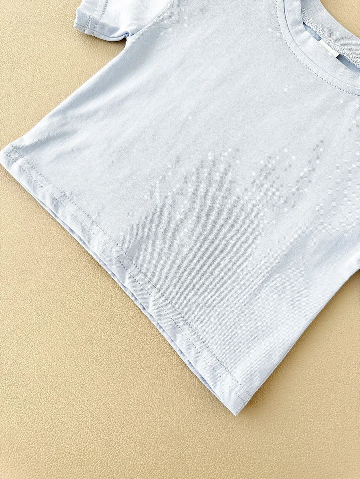 White t-shirt on a beige background