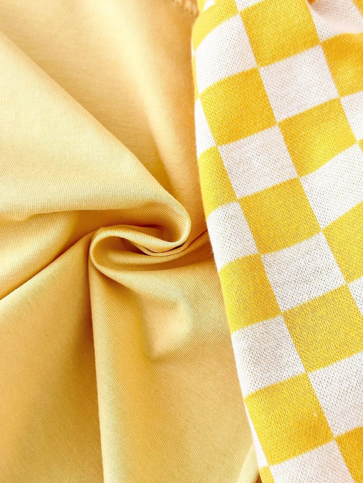 Close-up of yellow fabric with a checkered pattern