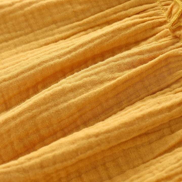 Close-up of yellow fabric with visible texture