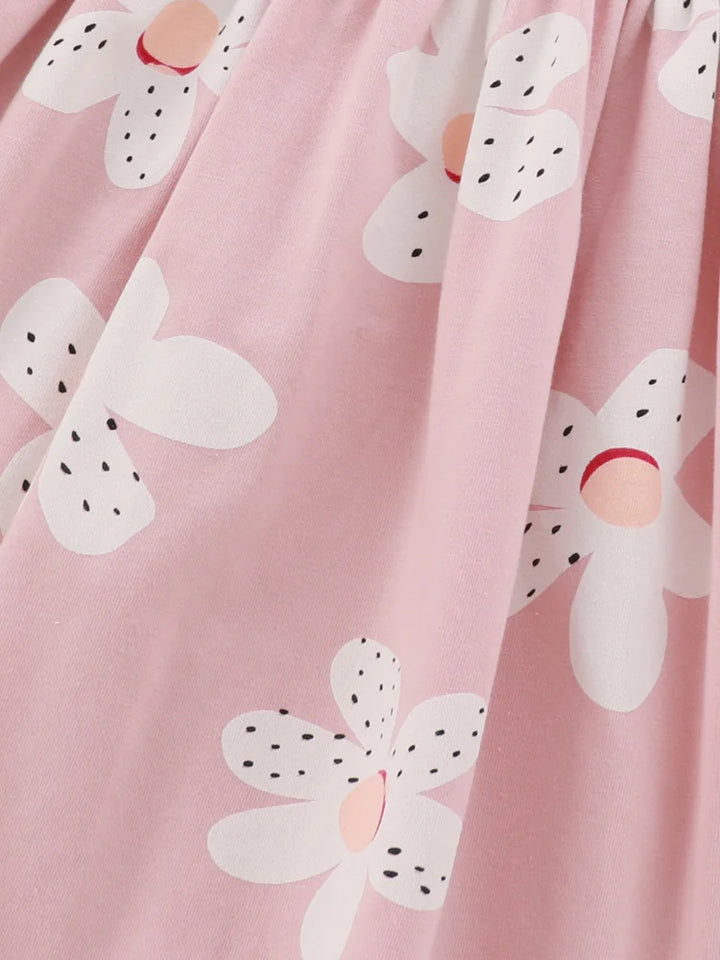 Pink fabric with white floral patterns