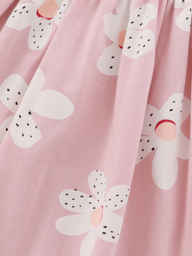 Pink fabric with white floral patterns