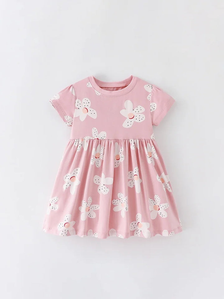 Pink dress with white floral patterns on a light gray background