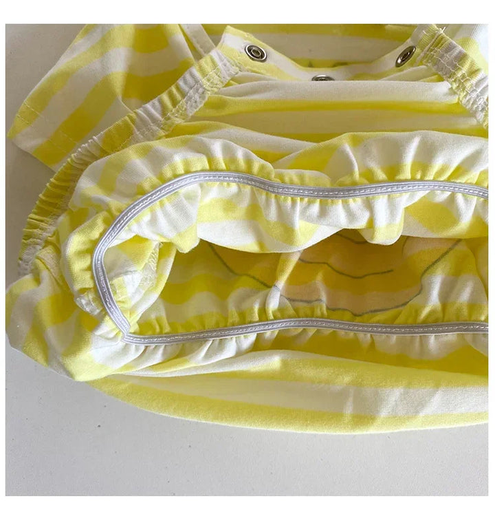 Yellow and white striped fabric with a close-up of the pattern on a white background