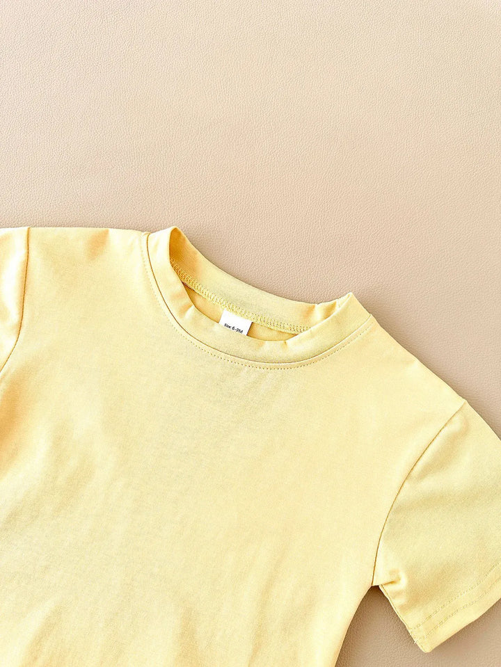 Yellow t-shirt on a beige background