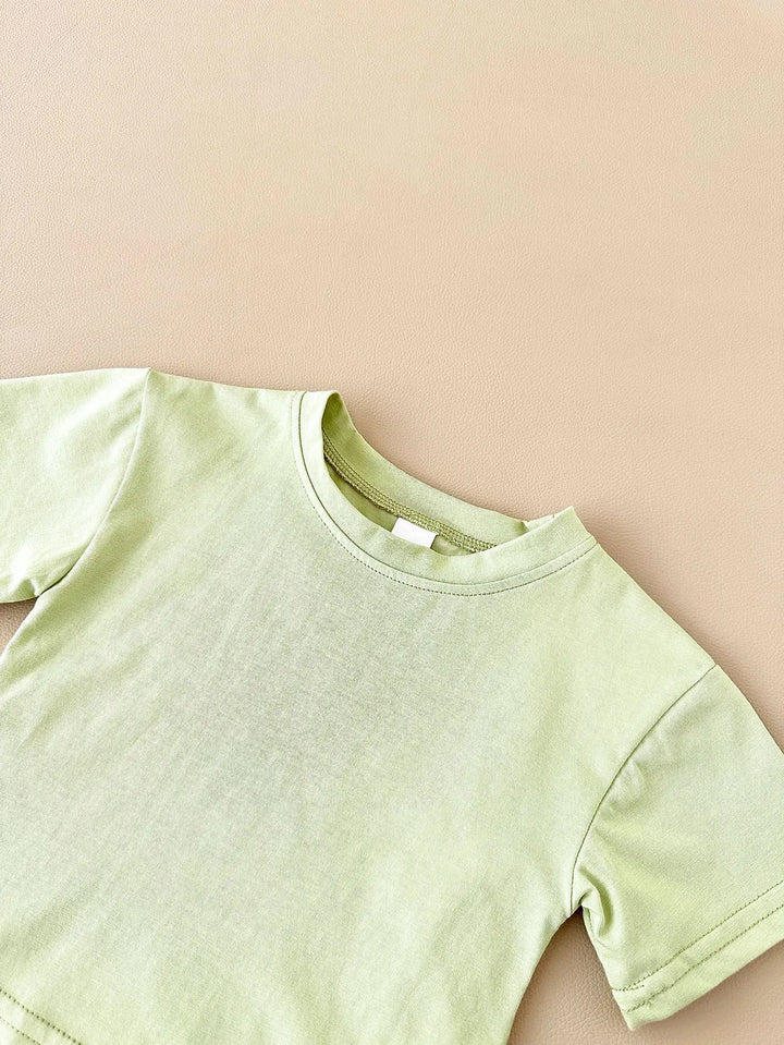 Light green t-shirt on a beige background