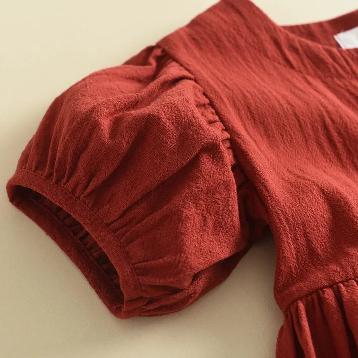 Red textured top on a beige background