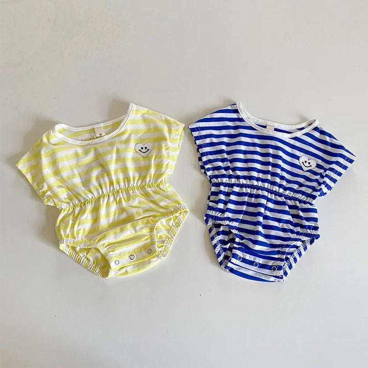 Two baby rompers, one yellow with white stripes and the other blue and white stripes, on a light gray background.