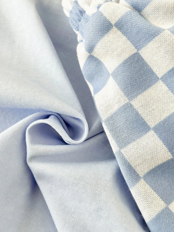 Close-up of light blue fabric with a checkered pattern
