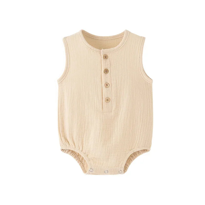 Beige baby romper with button details on a white background