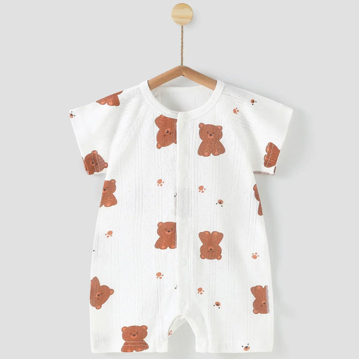 Baby romper with bear pattern on a hanger against a white background