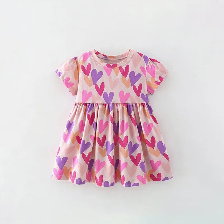 Pink dress with heart pattern on a white background