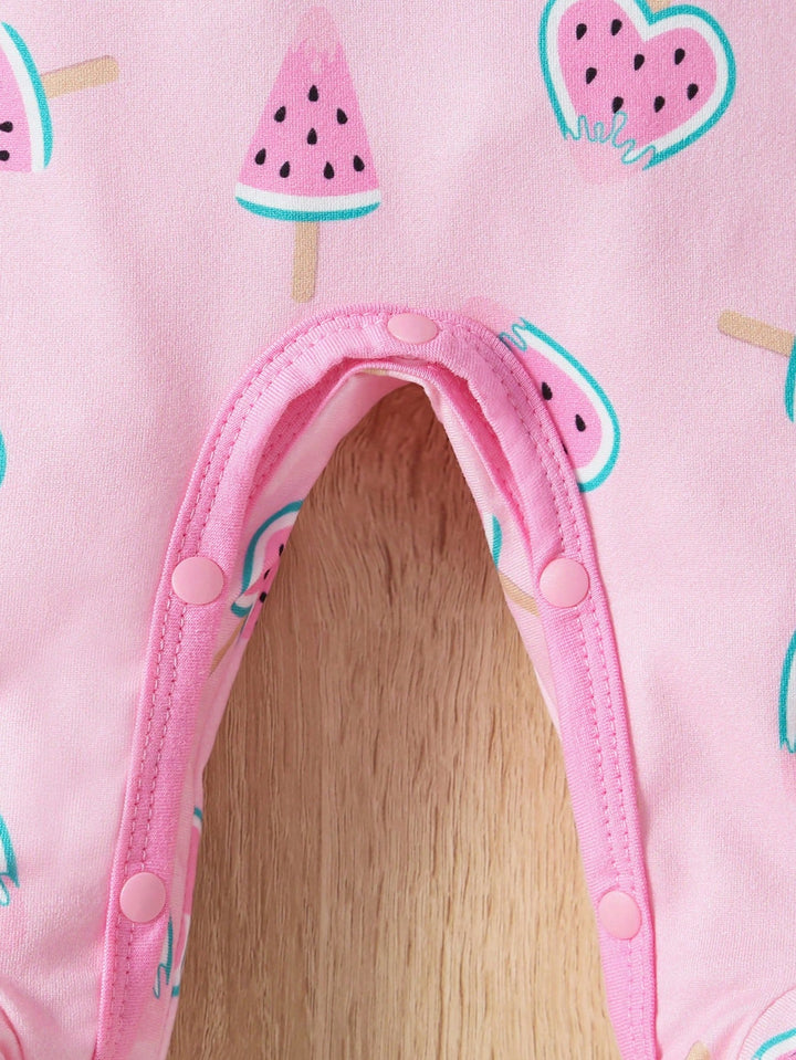 Close-up of a pink hat with watermelon designs on a matching pink background