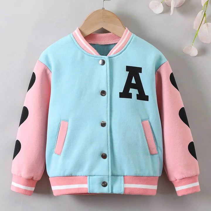 Light blue and pink varsity jacket with black letter 'A' on a hanger against a gray background