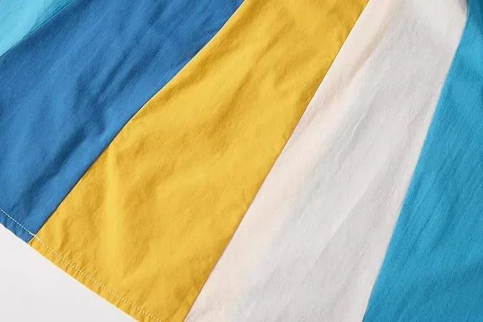 Close-up of fabric with blue, yellow, and white colors.