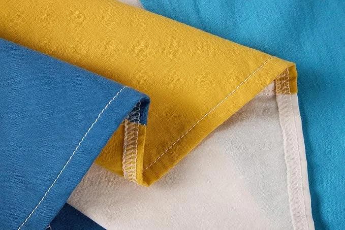 Close-up of fabric with blue, yellow, and white colors.
