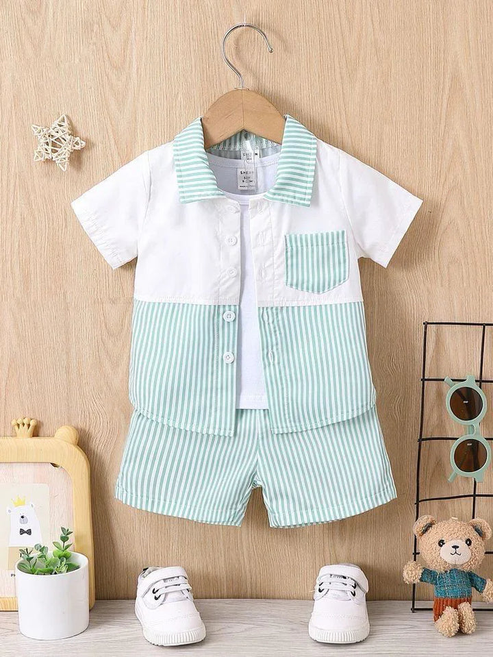 Children's outfit with a shirt and shorts on a hanger against a wooden background.