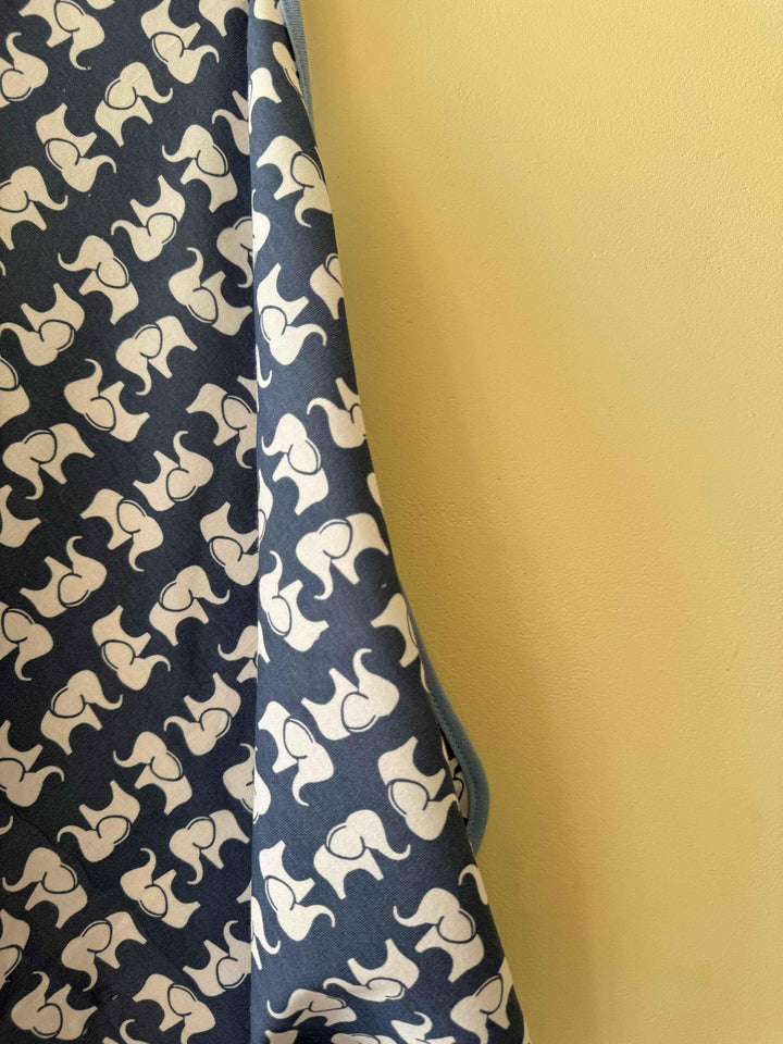 Navy fabric with white elephant pattern against a yellow background