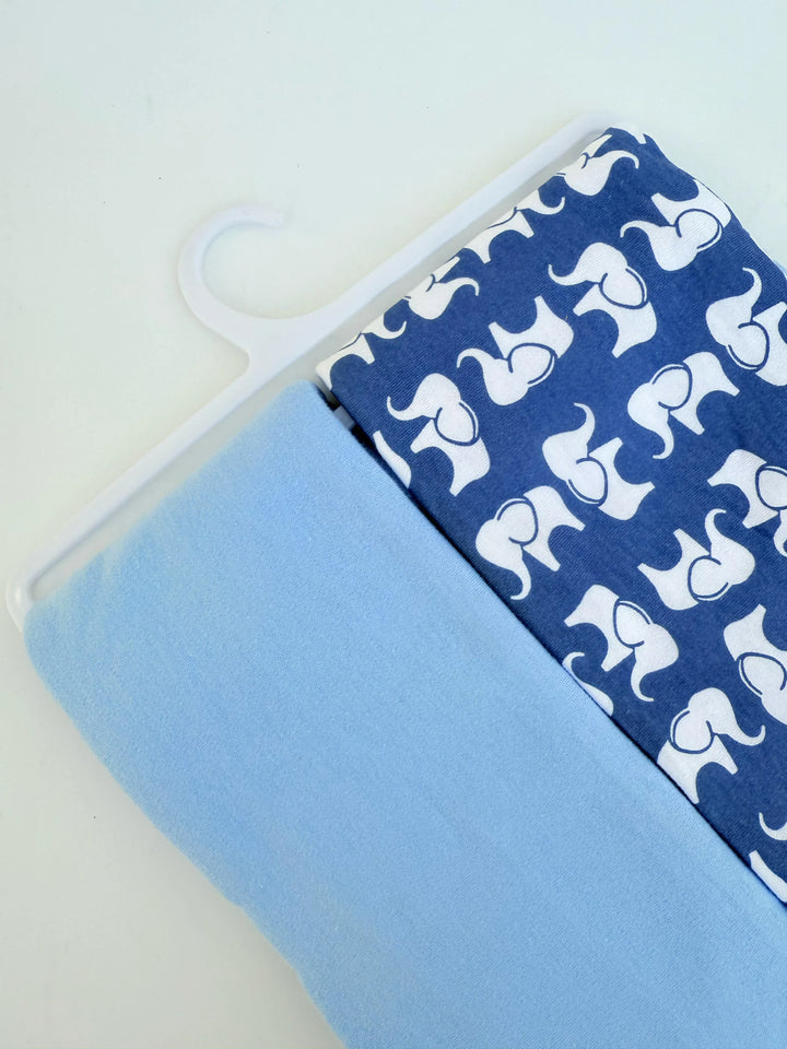 Phone case with blue background and white elephant pattern