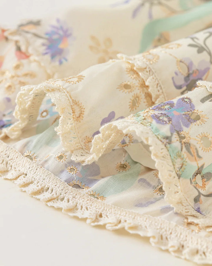 Floral fabric with lace trim on a white background